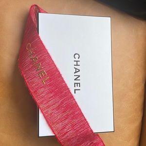 Chanel box empty with red Chanel Ribbon. 9in by 6in
